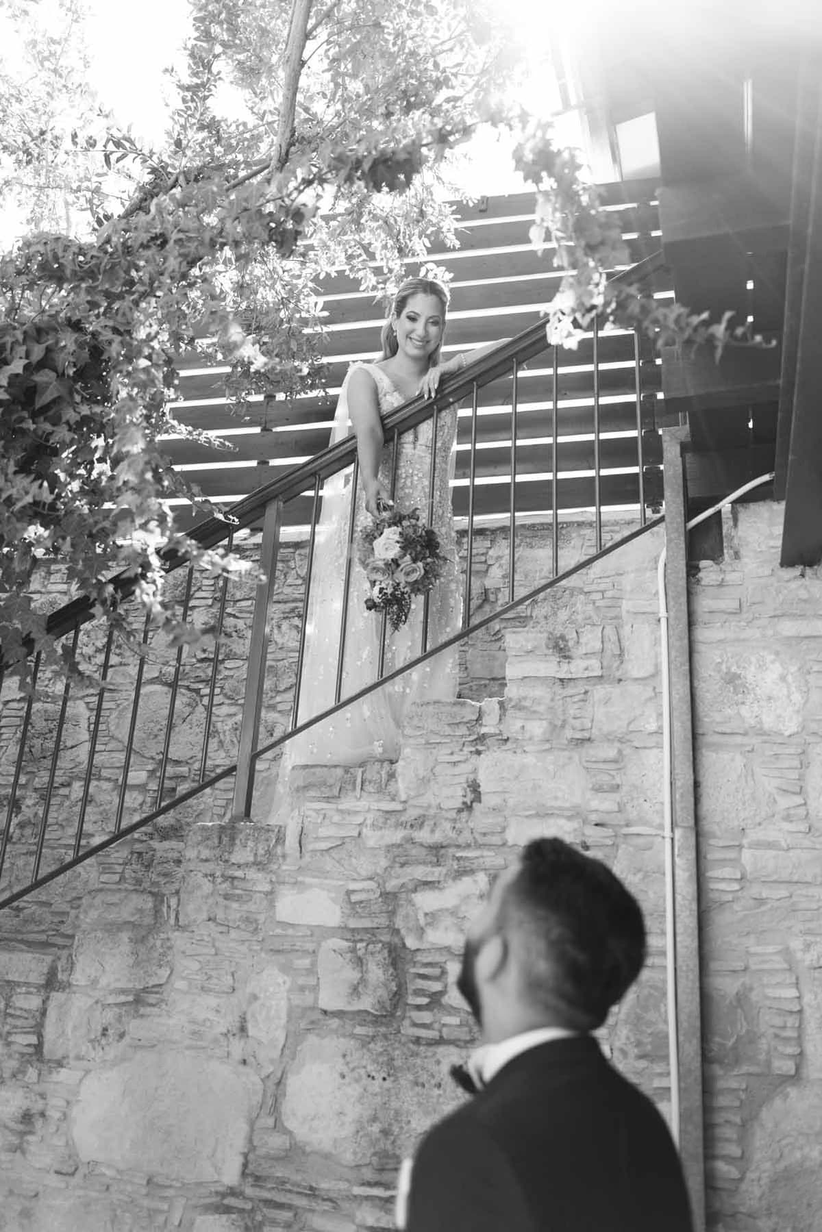 Couple in wedding attire at the entrance of a restaurant