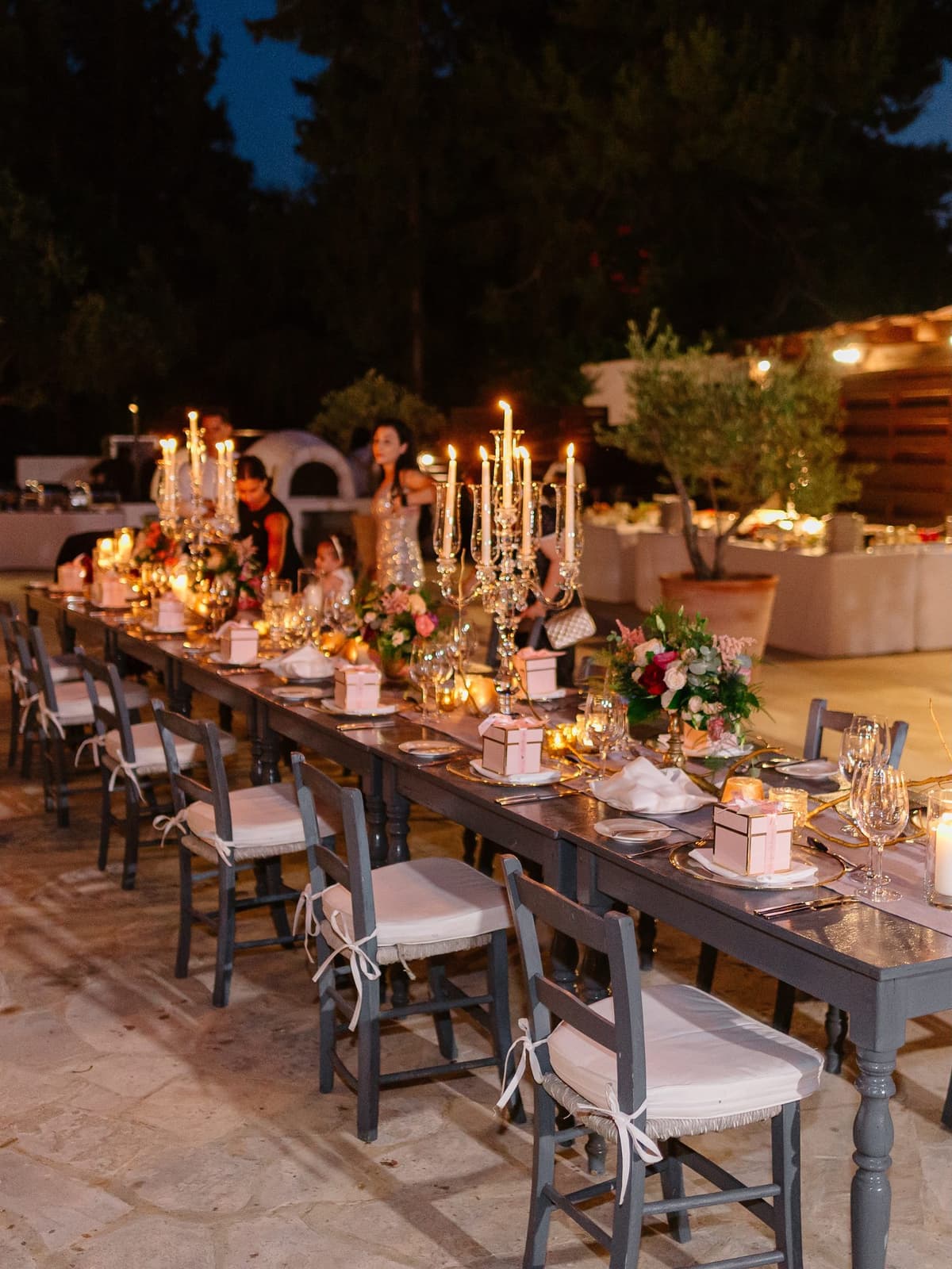 The reception tables set by candlelight