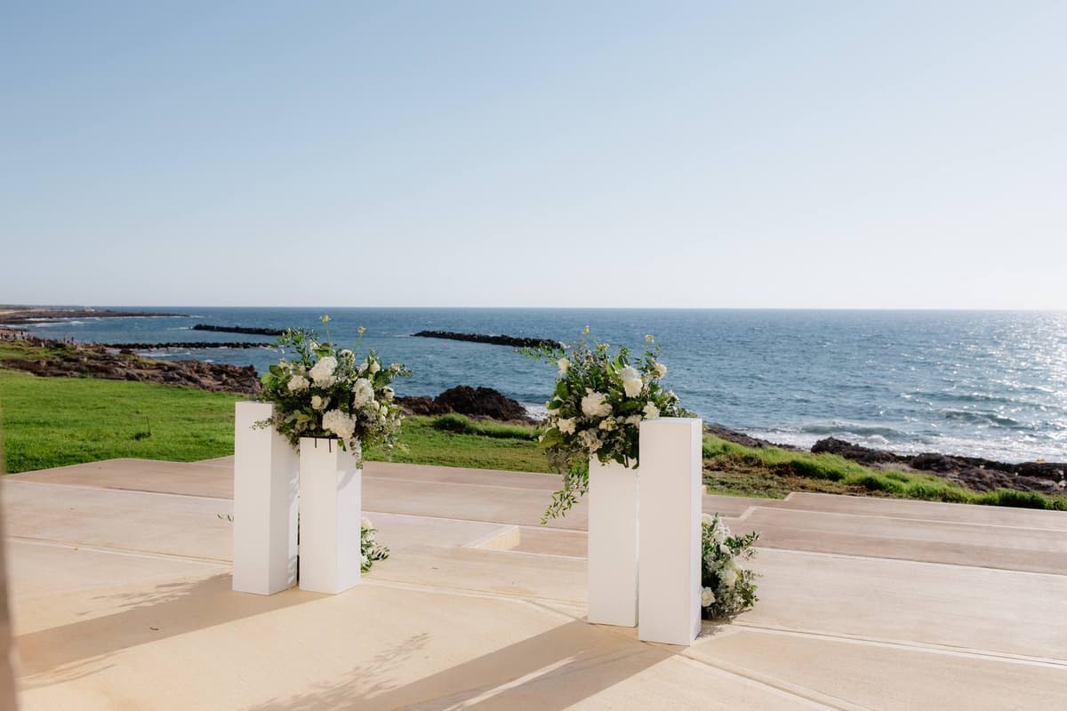 Christos & Eleni, the ceremony aisle with the sea behind