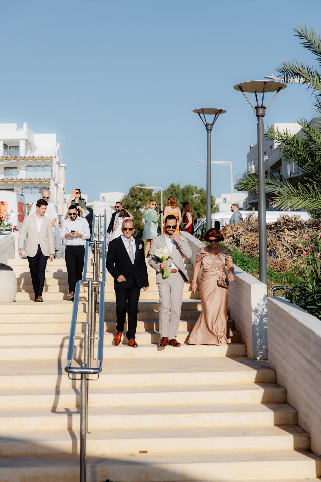 Christos & Eleni, guests arriving down the steps to the chapel