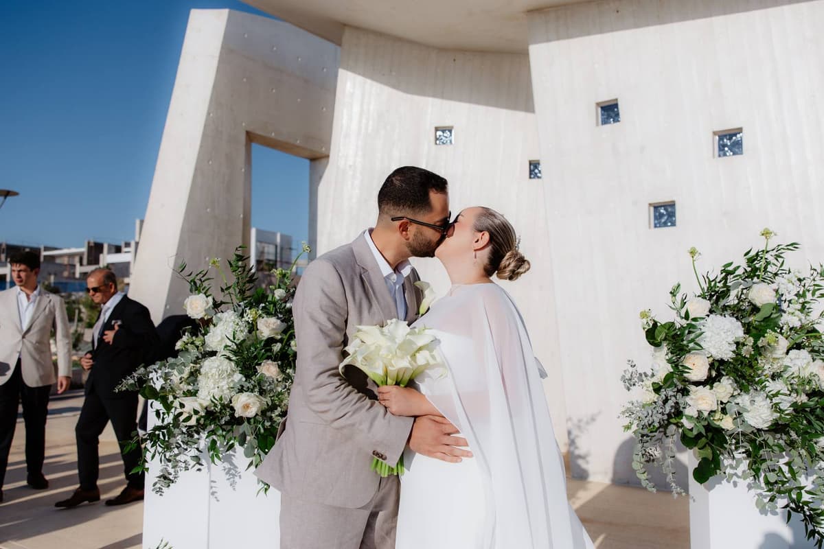 Christos & Eleni, a first kiss on the cheek at the chapel