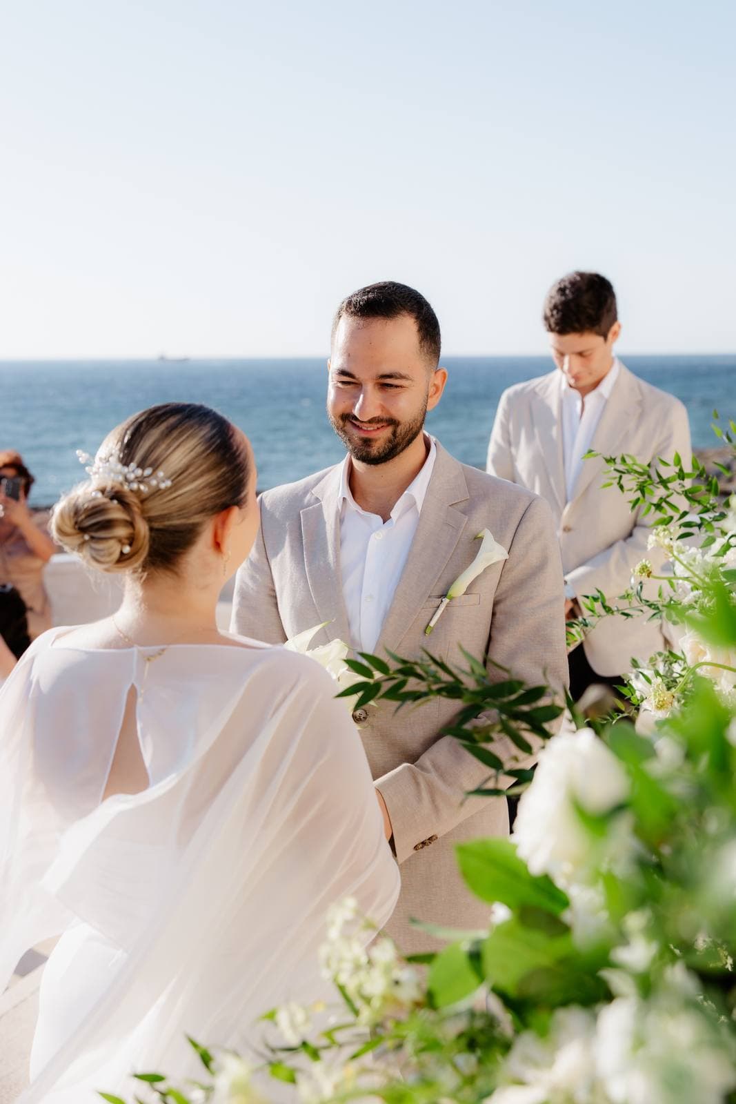Christos & Eleni, the bride and groom at the ceremony by the sea