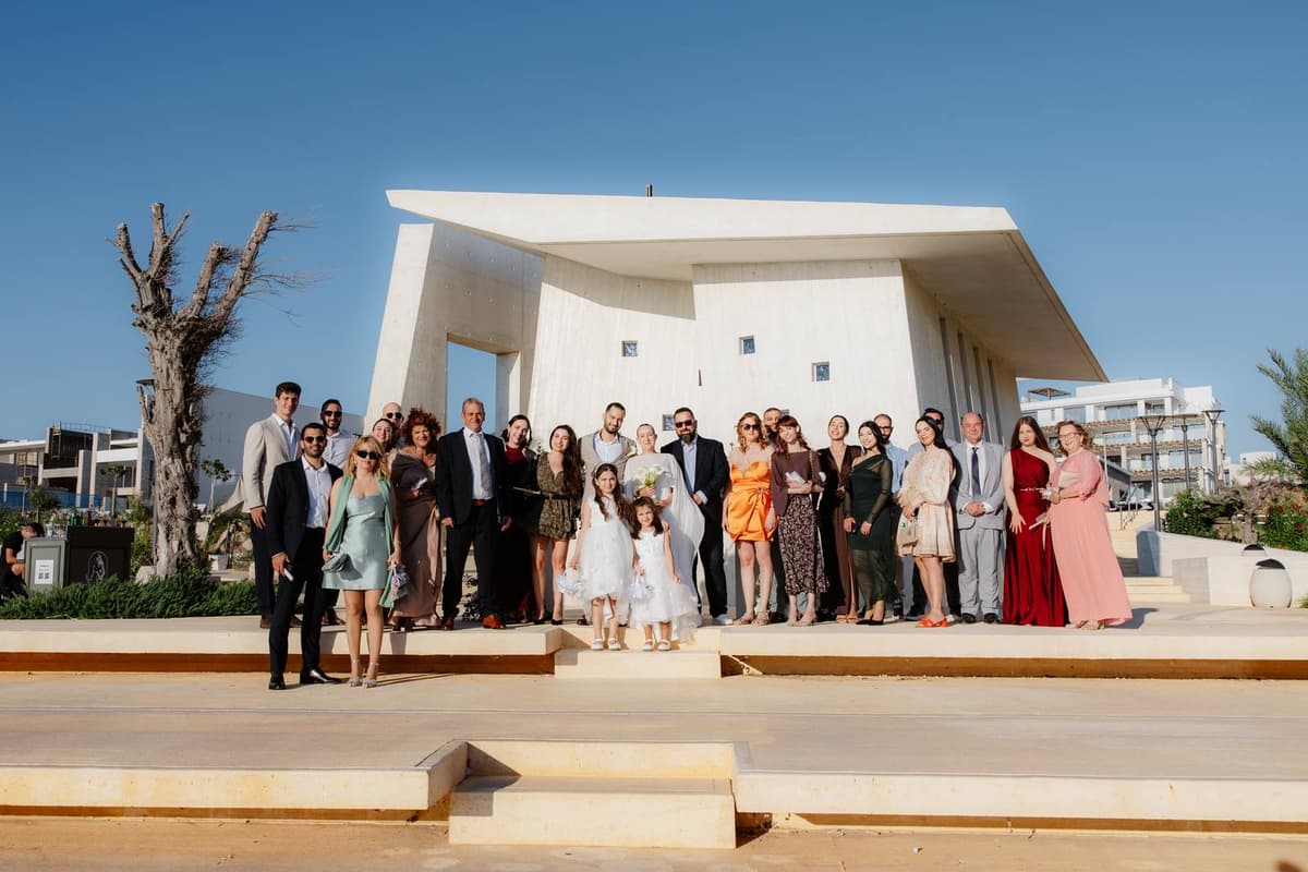 Christos & Eleni, family and friends in front of the chapel