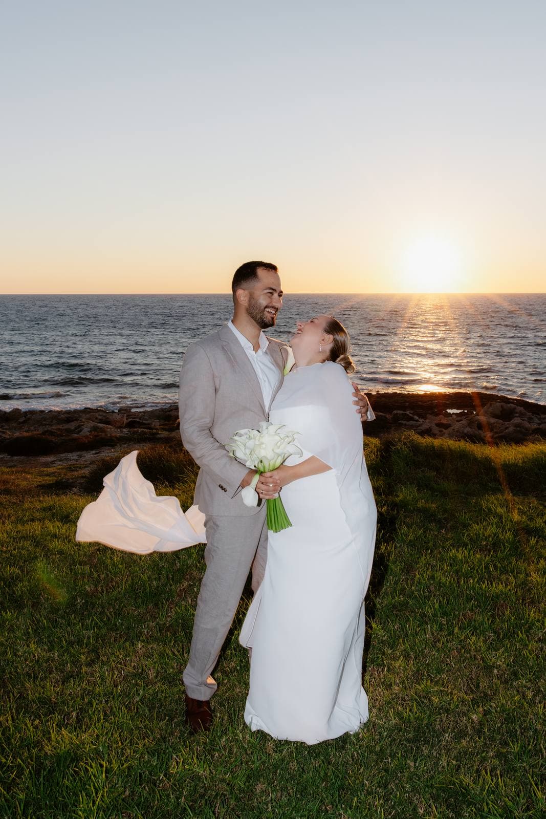 Christos & Eleni, a kiss with the sun going down