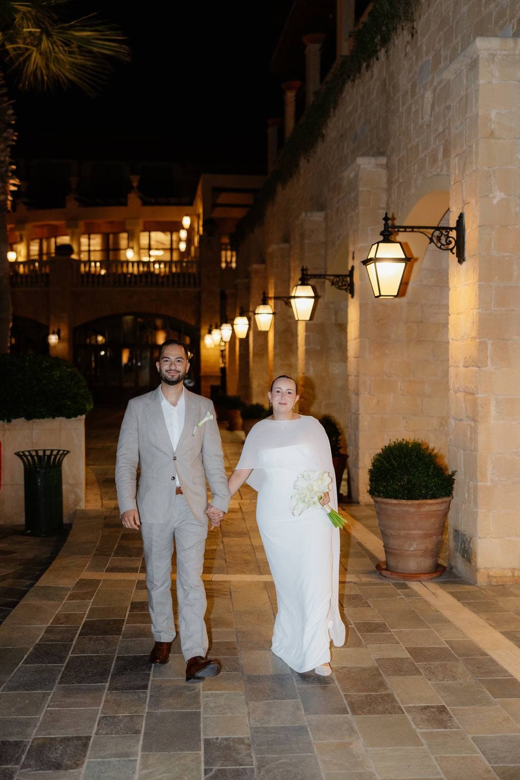 Christos & Eleni, guests walking through the arcades of Elysium