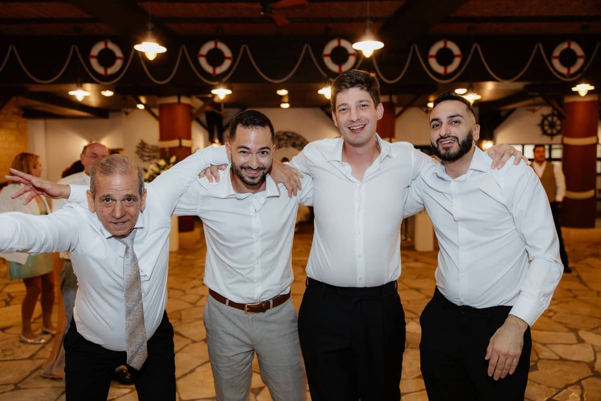 Christos & Eleni, the groom and his friends dancing