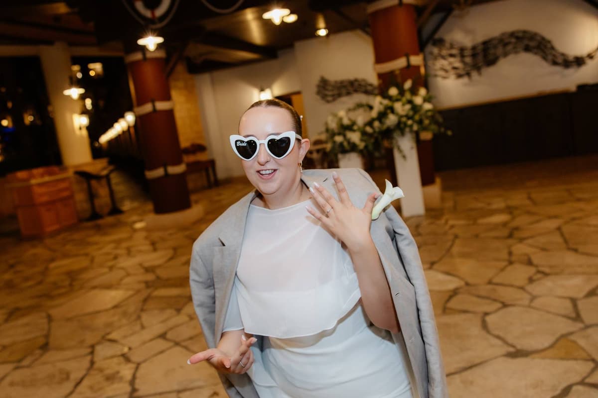 Christos & Eleni, the bride in heart sunglasses