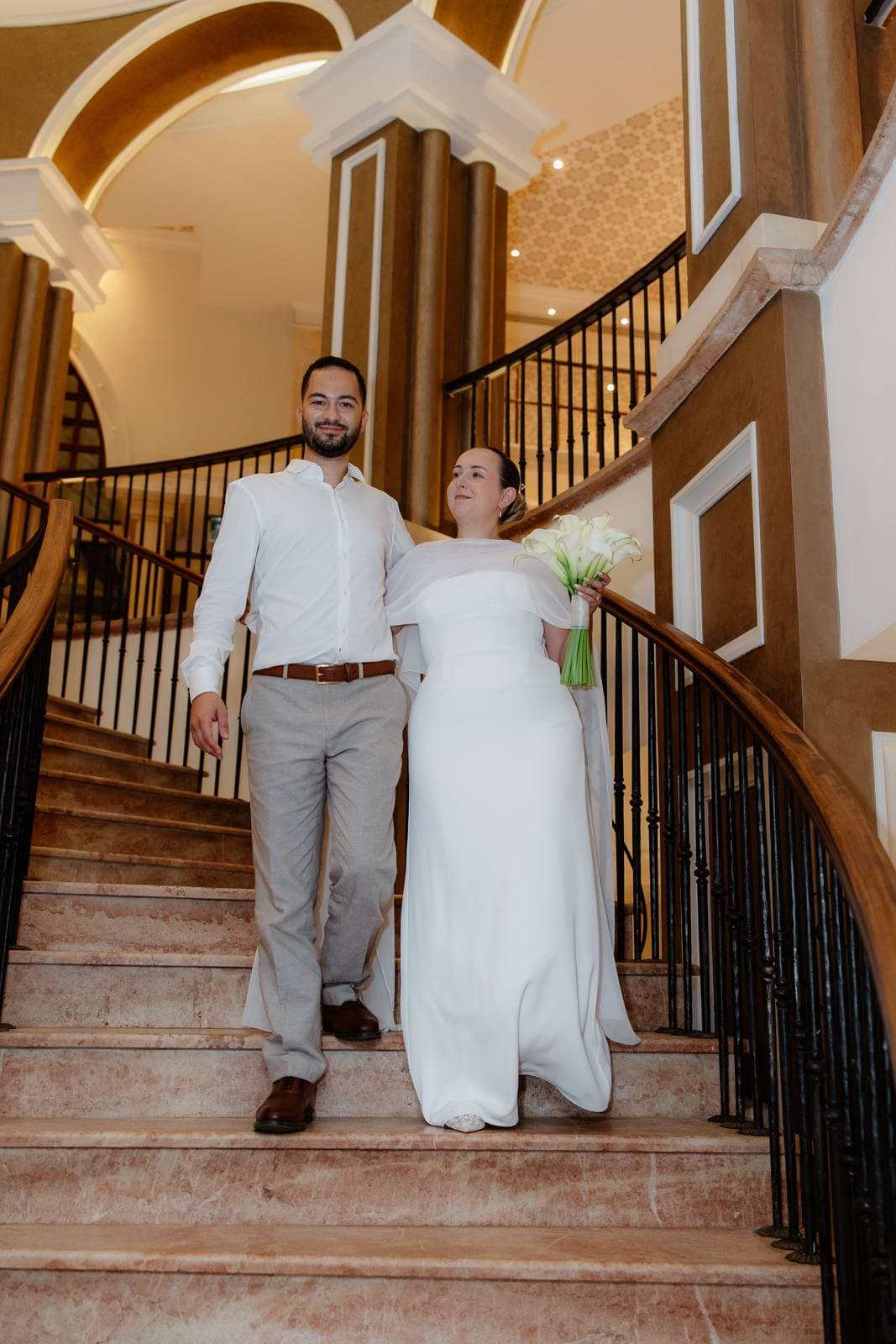 Christos & Eleni, bride and groom on the staircase at Elysium