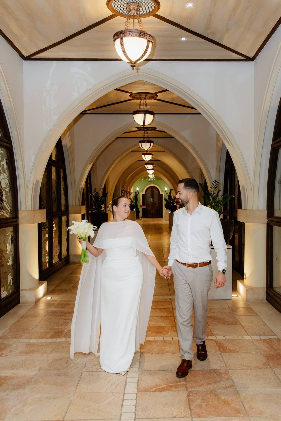 Christos & Eleni, walking through the arches of Elysium