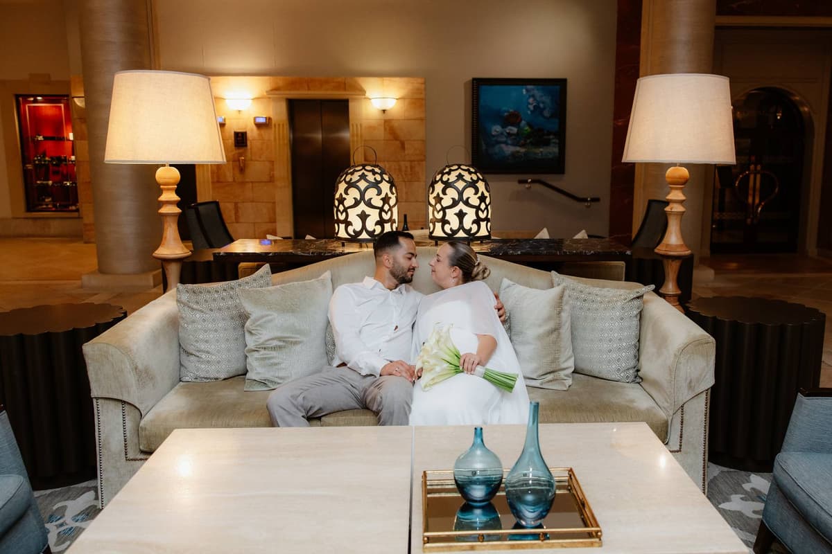 Christos & Eleni, on the sofa in the hotel lobby