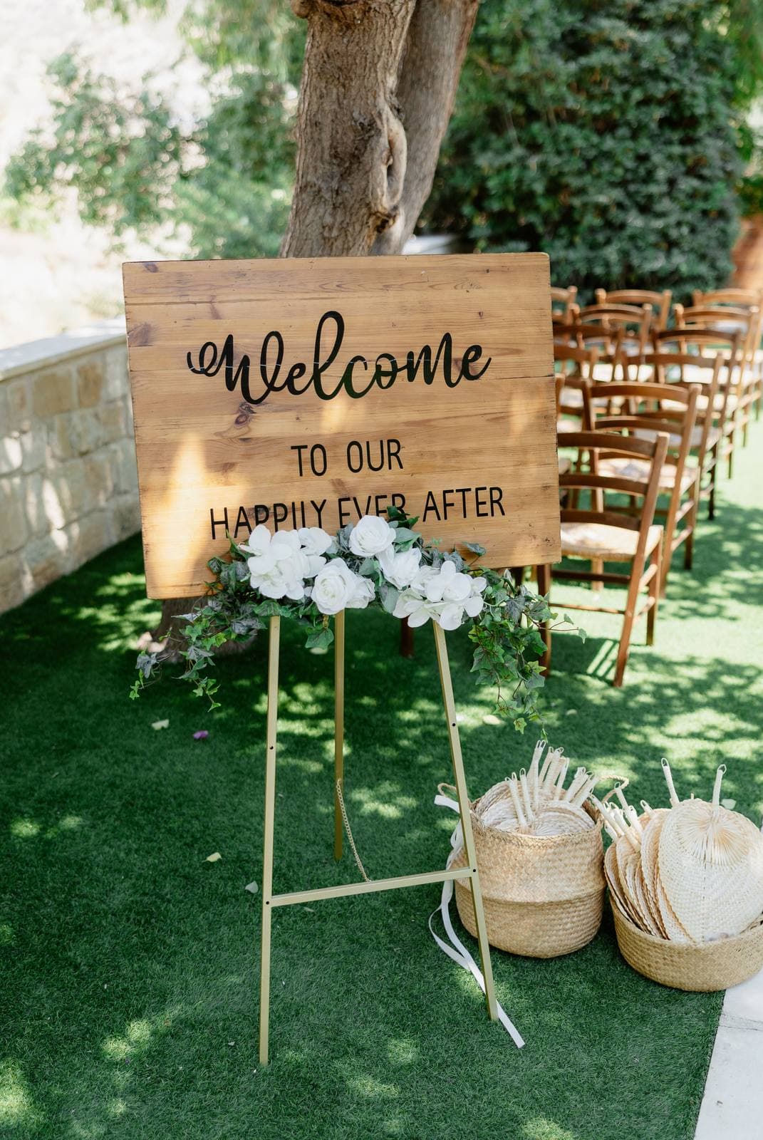 Hannah & Danial, the welcome sign in the garden at Vasilias Nikoklis Inn