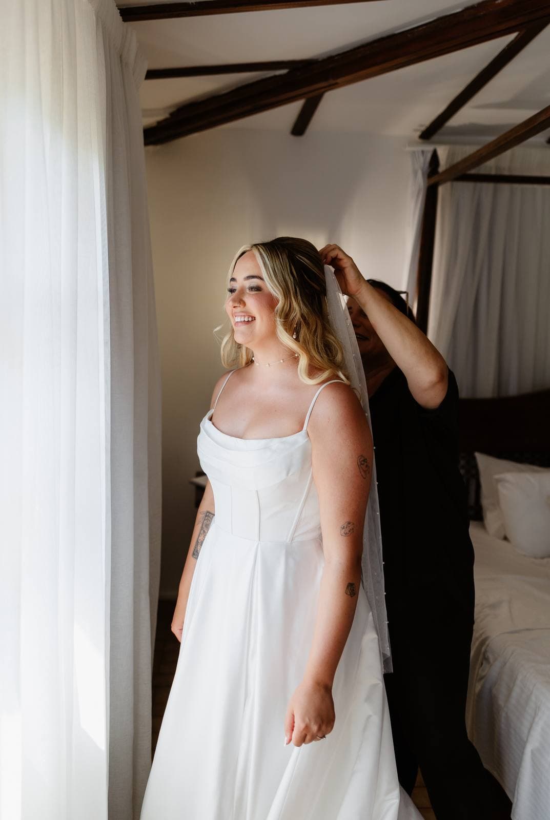 Hannah & Danial, the bride with her veil in the morning light
