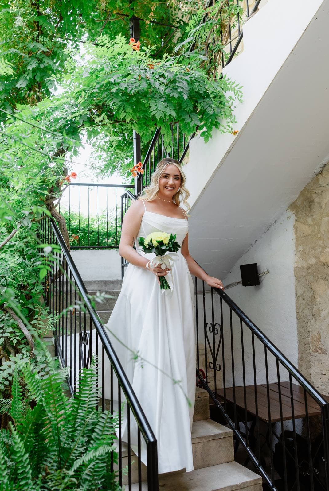 Hannah & Danial, the bride coming down the garden steps at Vasilias Nikoklis Inn