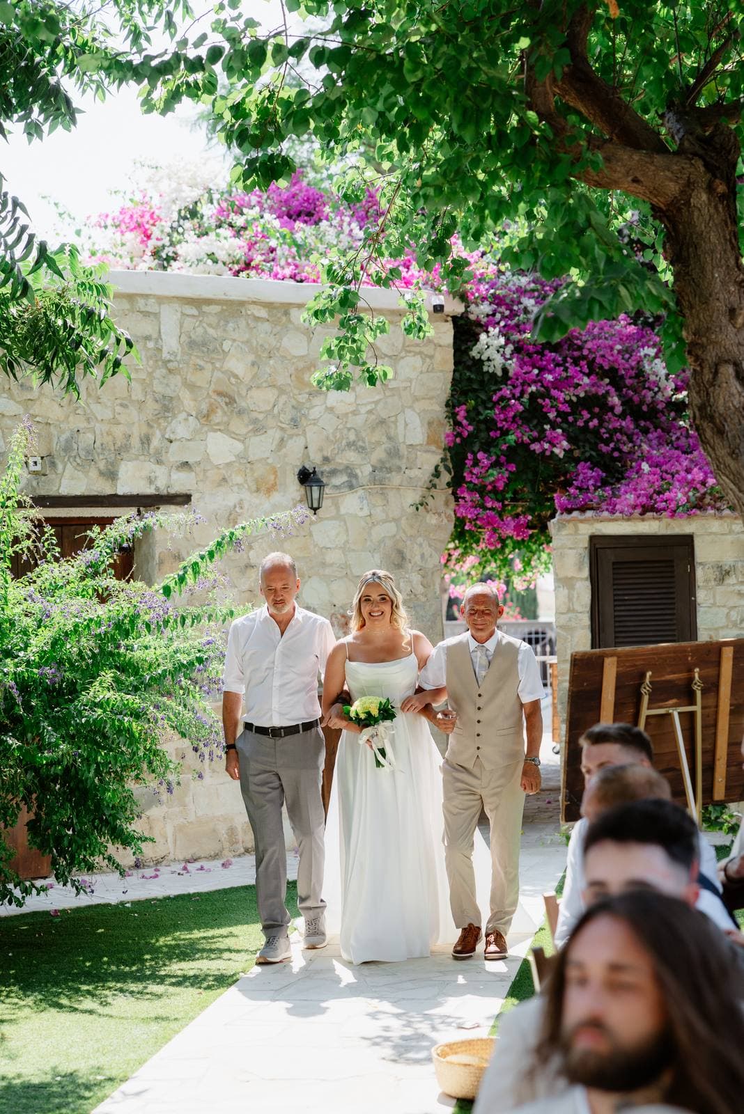 Hannah & Danial, the bride walking down the aisle