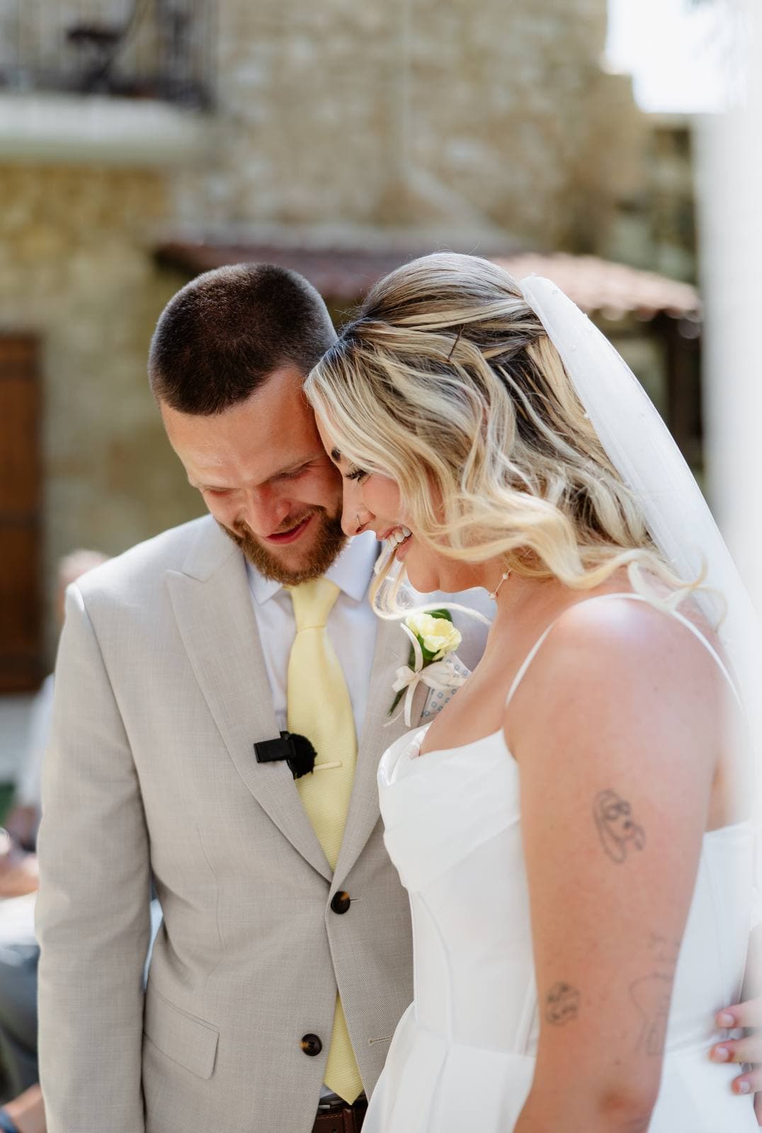 Hannah & Danial, bride and groom laughing together after the ceremony