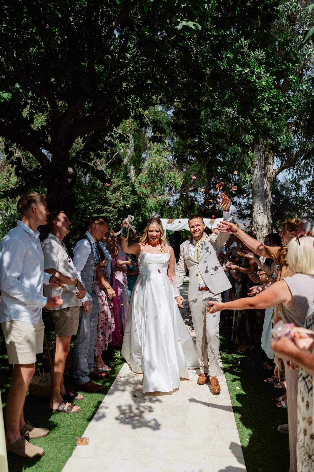 Hannah & Danial, walking back down the aisle through the guests
