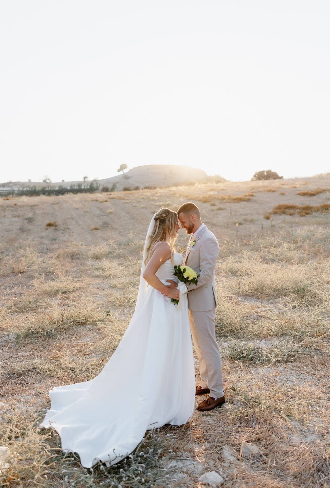 Hannah & Danial, bride and groom in the dry hills at sunset