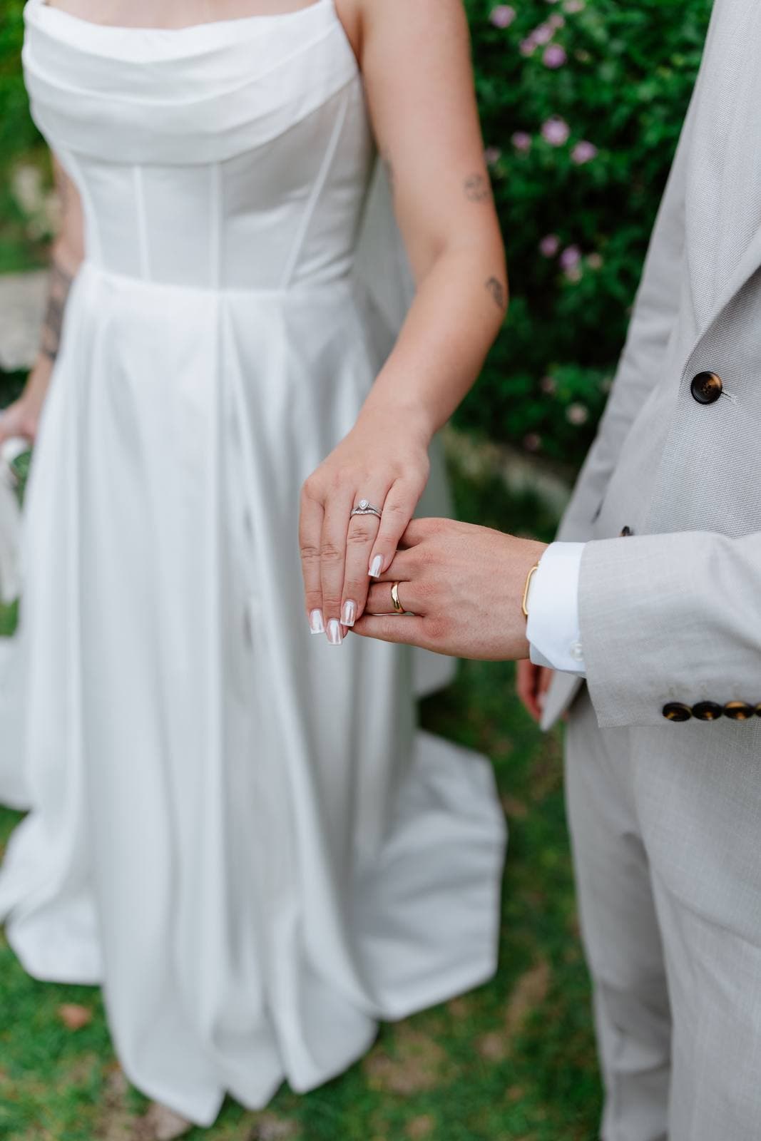Hannah & Danial, holding hands, the wedding rings