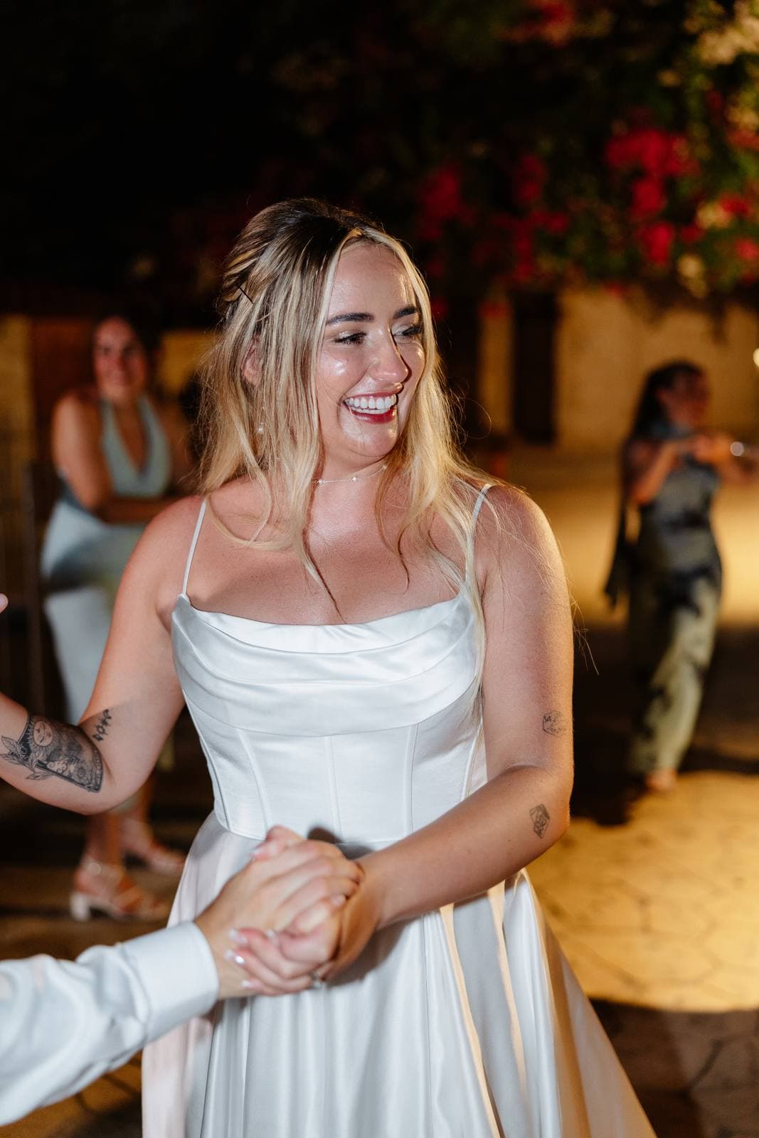 Hannah & Danial, the bride laughing on the dance floor