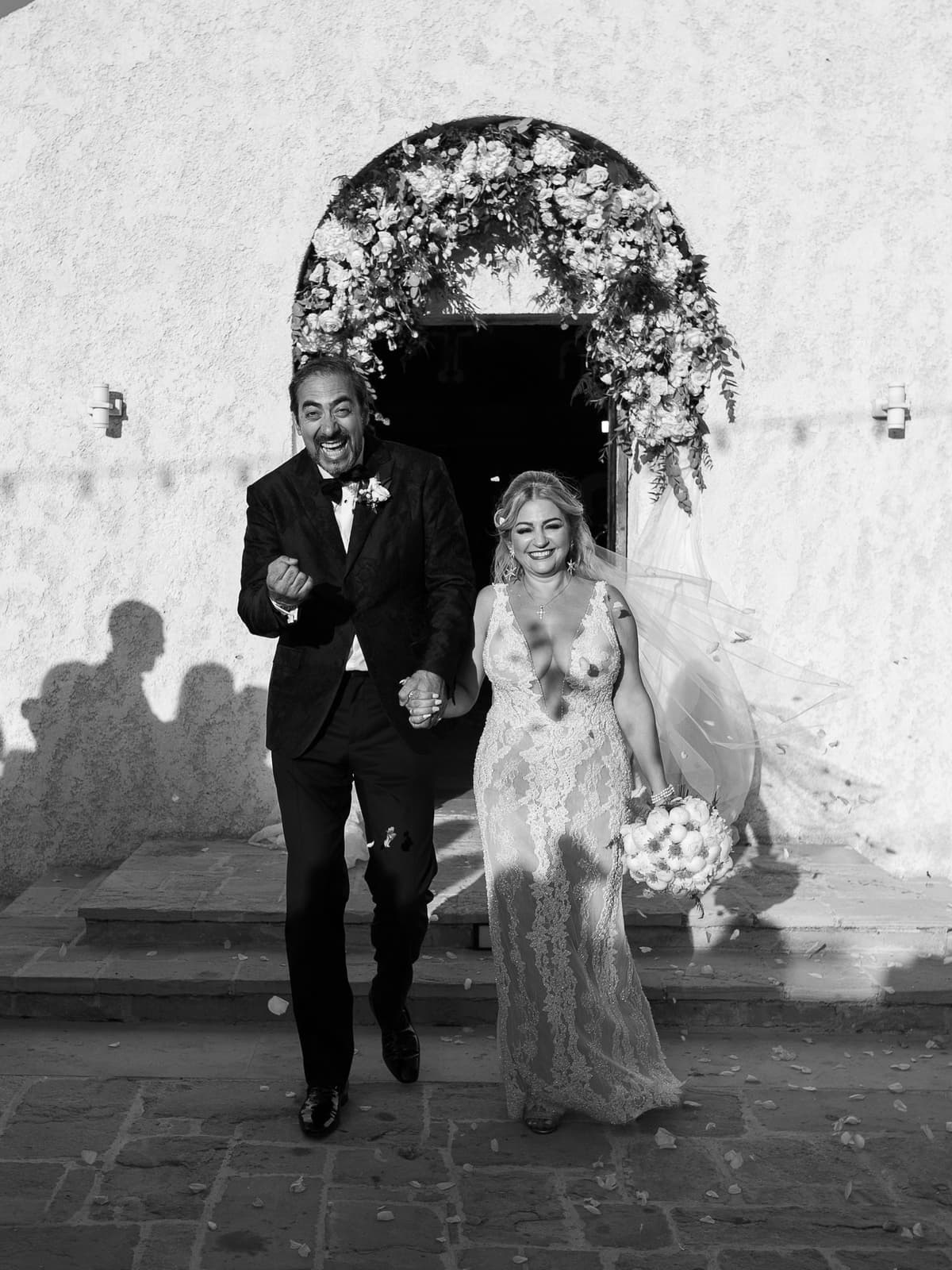 Leaving the chapel together, in black and white