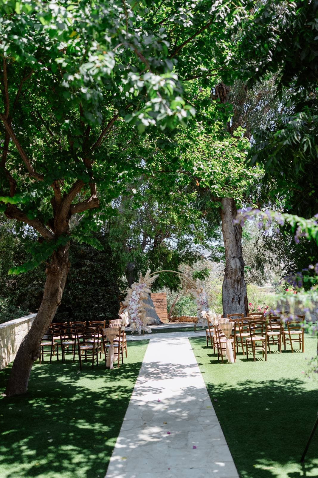 Rita & Andrej, the garden ceremony aisle at Vasilias Nikoklis Inn