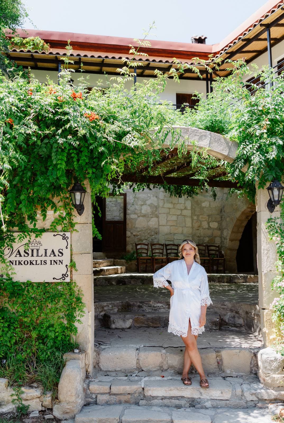 Rita & Andrej, the bride at the entrance of Vasilias Nikoklis Inn