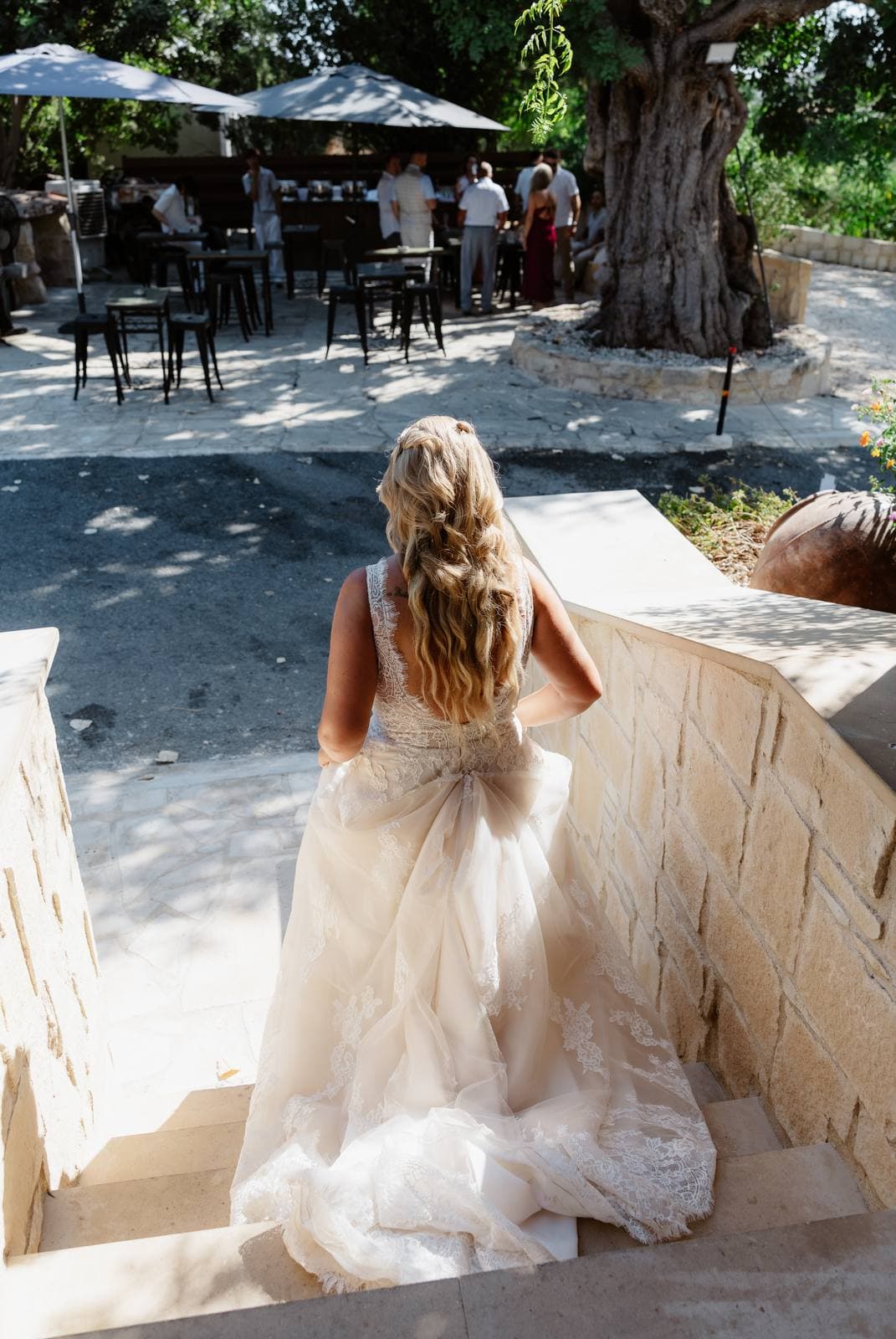 Rita & Andrej, the bride walking down the steps to the terrace