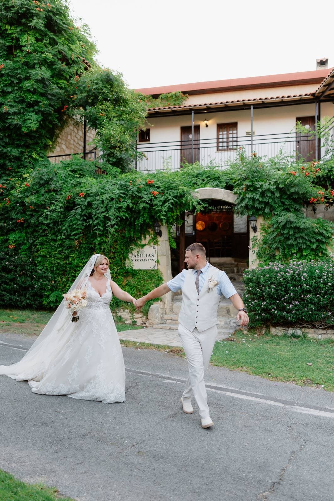 Rita & Andrej, bride and groom on the road outside the inn