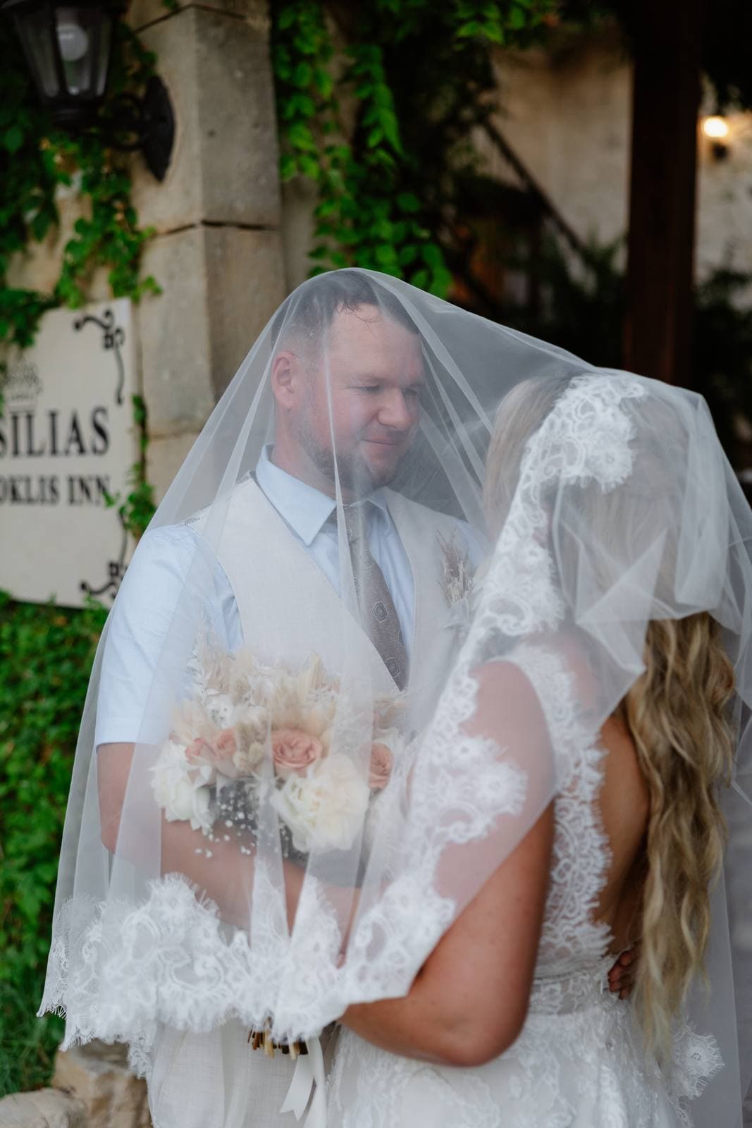 Rita & Andrej, under the veil at the entrance of Vasilias Nikoklis Inn