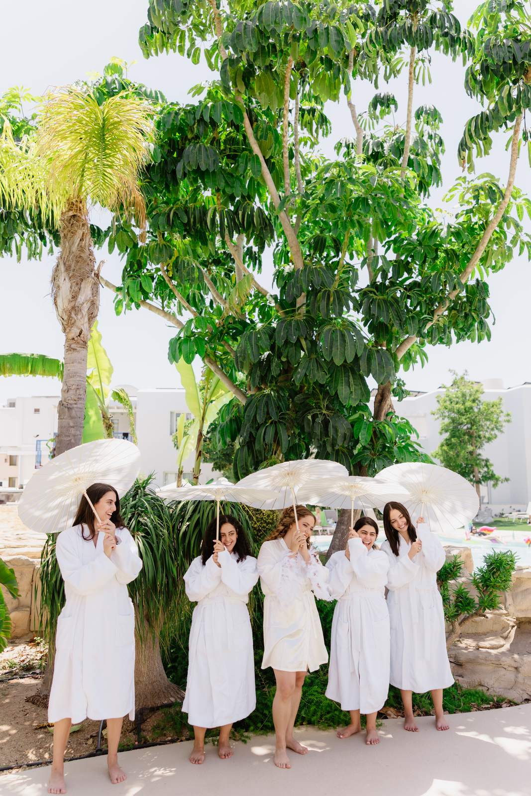 Sivan & Elon, the bridesmaids with their parasols