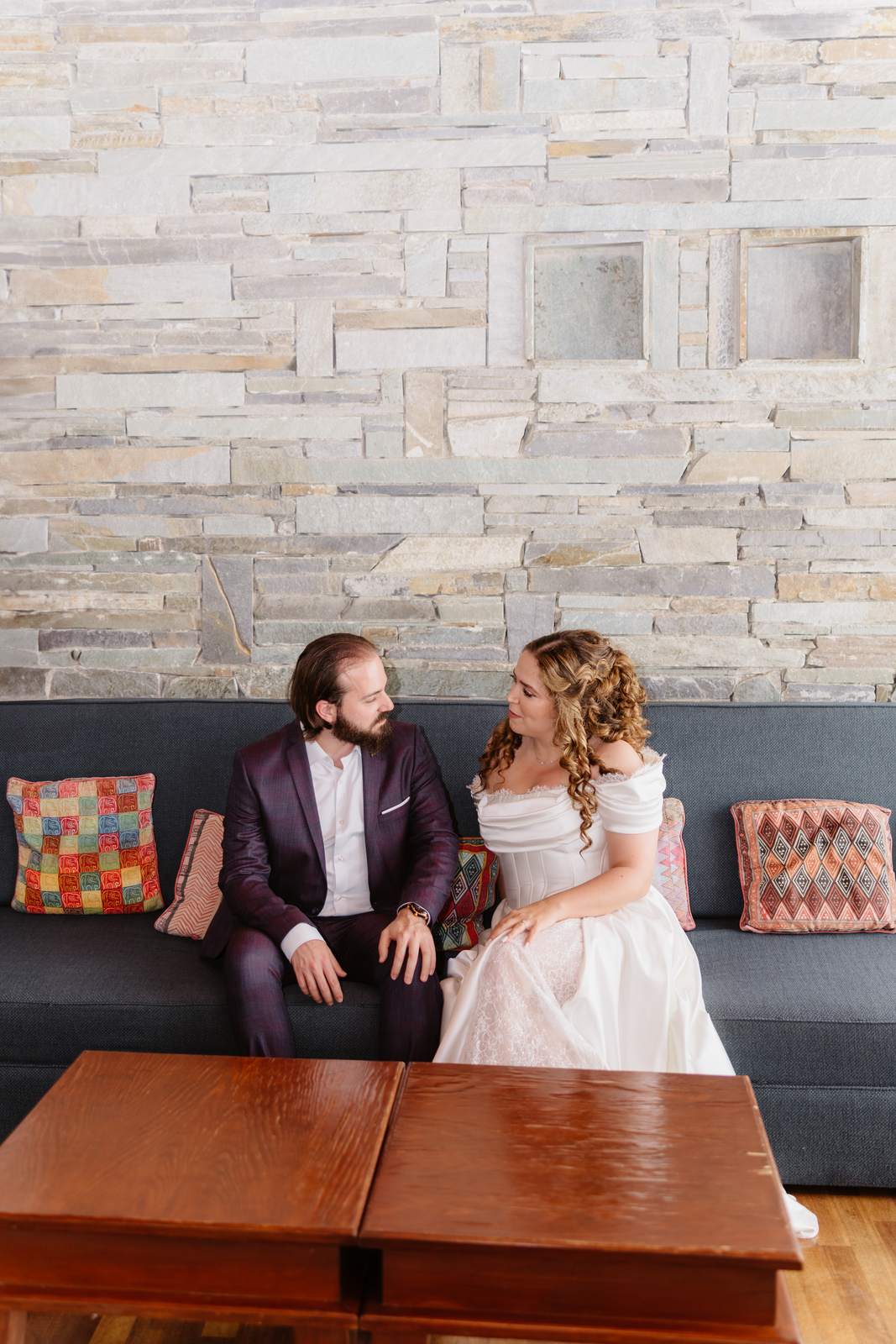 Sivan & Elon, together on the sofa at Elea Estate