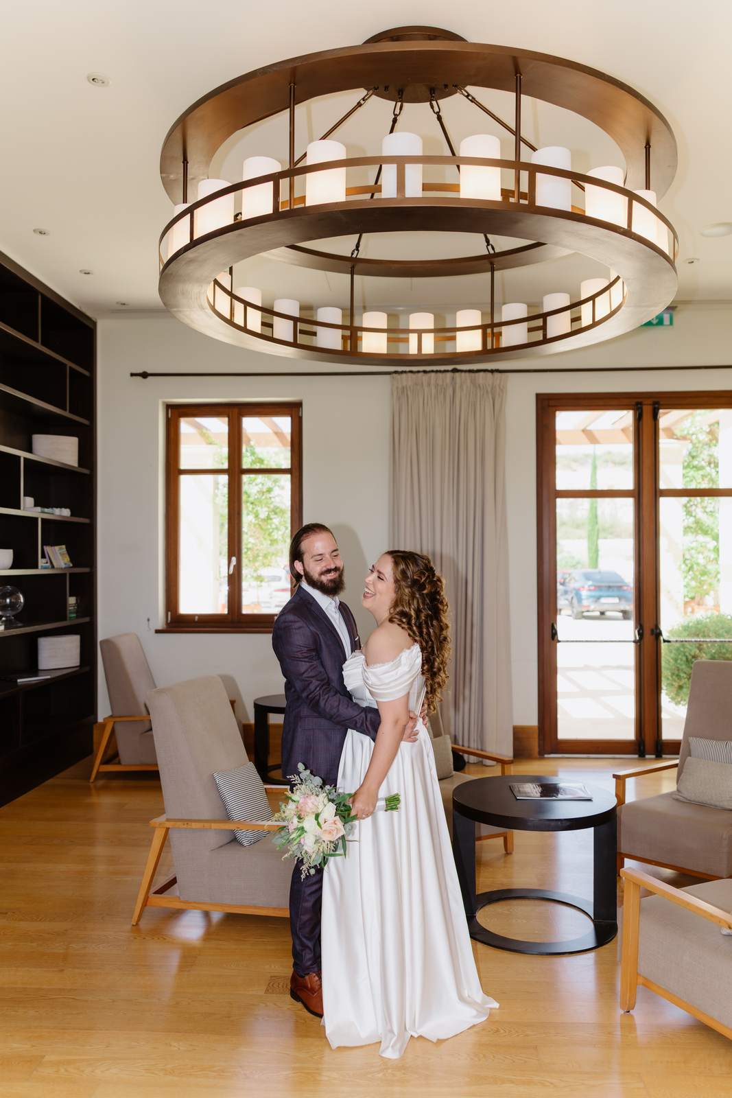 Sivan & Elon, in the lounge under the chandelier