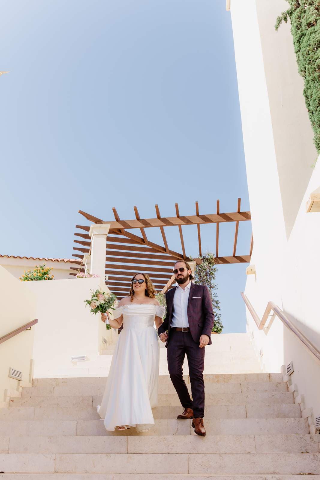 Sivan & Elon, walking down the white stairs