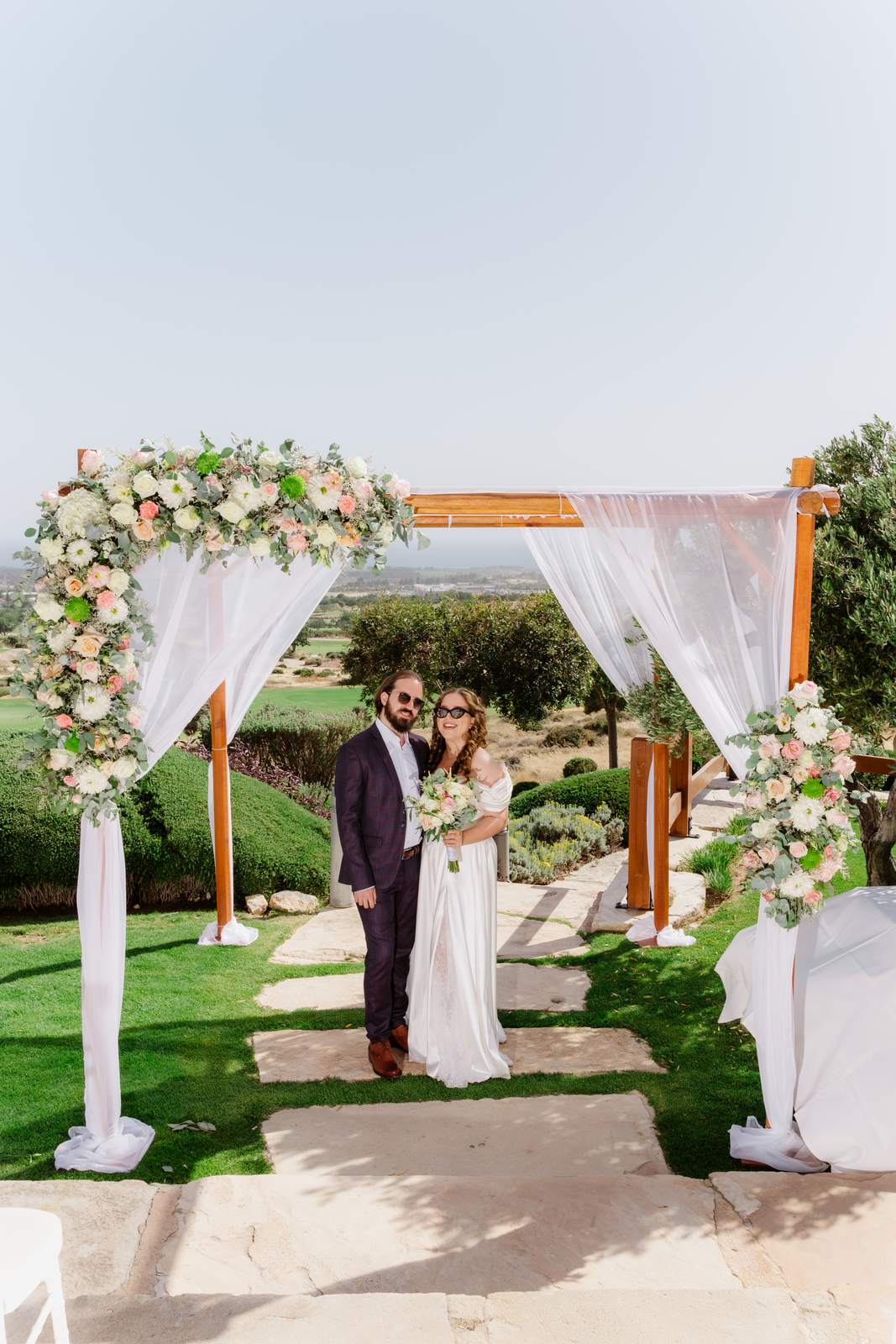 Sivan & Elon, the ceremony arch of flowers