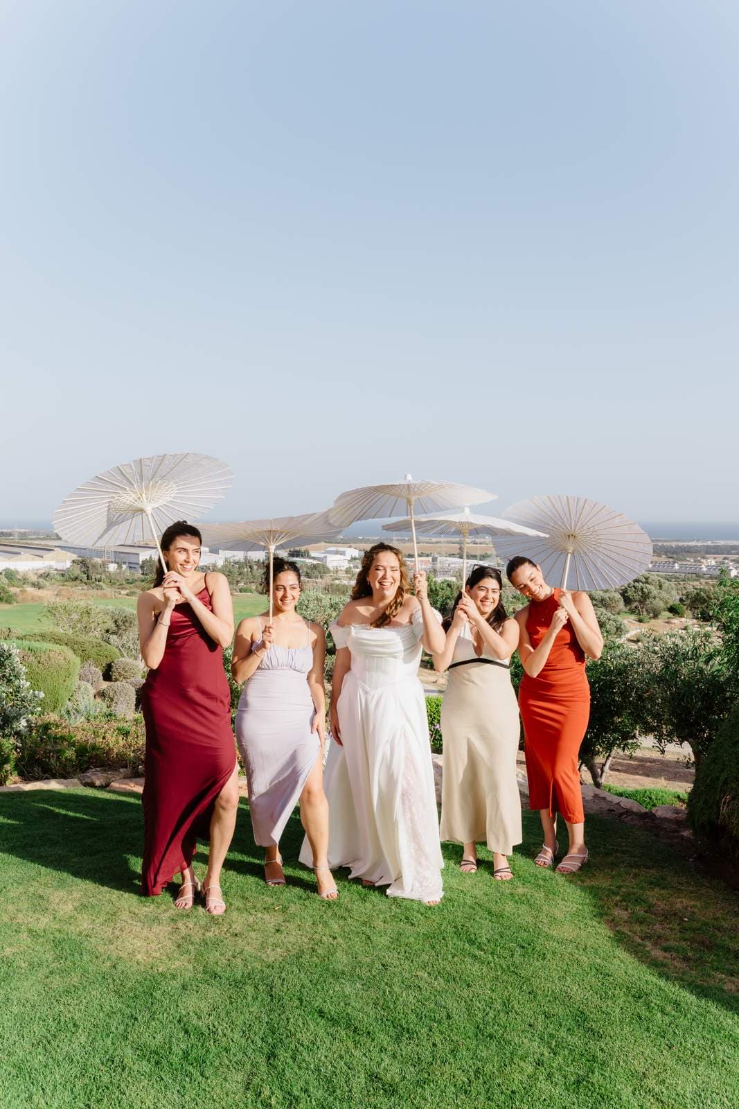 Sivan & Elon, the bridesmaids with their parasols